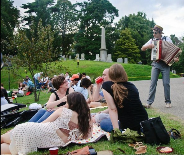 The entertainment began with accordianist Albert Behar serenading visitors as they picnicked next to Crescent Water.