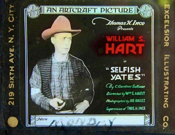 A coming attraction slide for "Selfish Yates," starring silent movie cowboy William S. Hart. This is one of about 50 such slides for Hart movies in The Green-Wood Historic Fund's Collections.