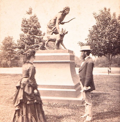 "The Indian Hunter" stands in Central Park. Here it is shown there in a half-stereoscopic view, circa 1875.