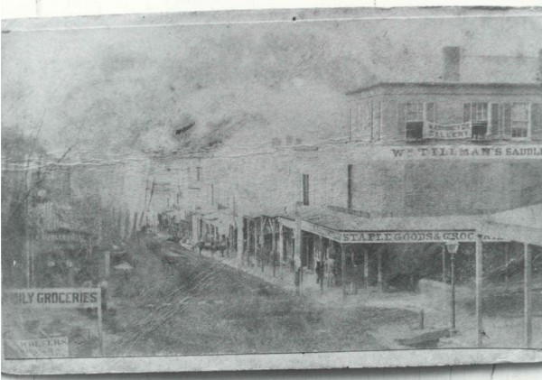 The street scene in Vicksburg. Note the banner for the Washington Gallery at right top.