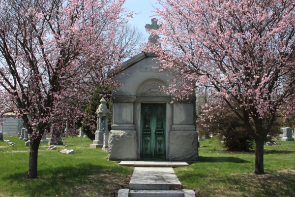 Cherry trees frame a mausoleum near Fort Hamilton Parkway.