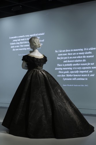The exhibition makes good use of quotations pertaining to mourning, projecting them onto the painted walls.Gallery View Anna Wintour Costume Center, Lizzie and Jonathan Tisch Gallery Image: © The Metropolitan Museum of Art