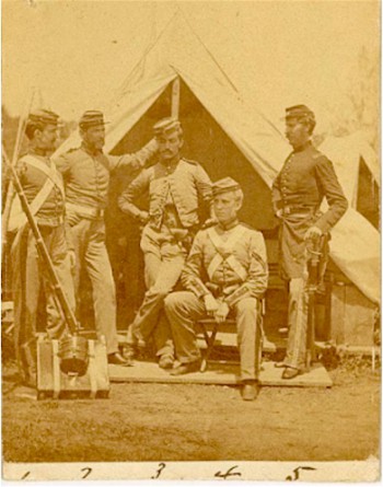 Monroe, at far right, is wearing the uniform of the 7th-frock coat with shoulder straps, kepi, eagle sword belt plate, and sword at his side.