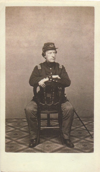Here Surgeon Cheeseman wears a single breasted frock coat; federal regulations stipulated that an officer was to wear a coat with two lines of buttons. 