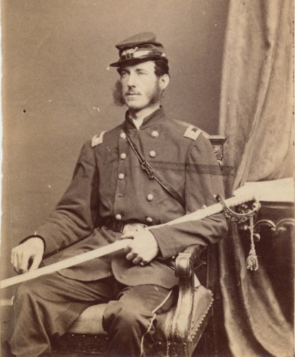 Lieutenant Colonel Lloyd Aspinwall, posing in a photographer's studio. 