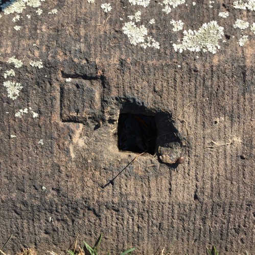 The brownstone coping, shot from above. Note the marking that Pitbladdo made in the stone; upon installation, the fence posts were slightly off, and had to be moved a few inches when they were installed in 1857.