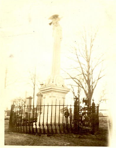 Photograph, circa 1875, showing the Vosburgh Monument and the cast iron fence around it. Note the fence posts, cast in the shape of Civil War muskets.