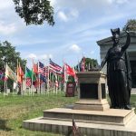 military flags and minerva statue