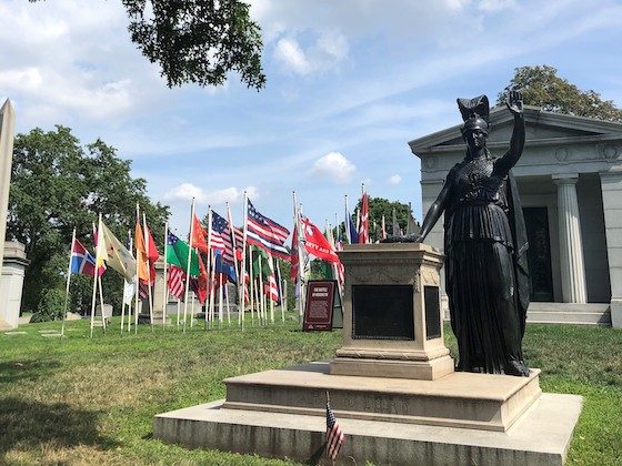 military flags and minerva statue