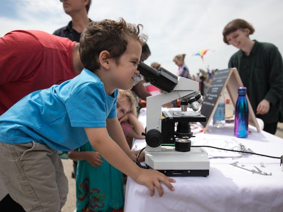 child with microscope