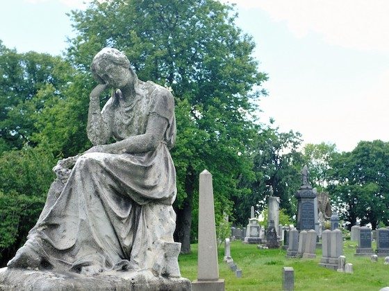 thoughtful statue cemetery