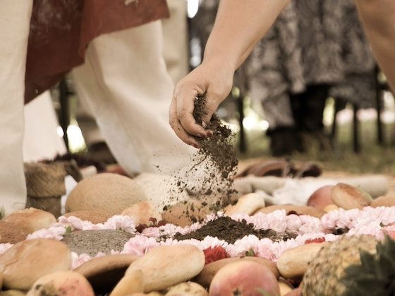 hand scattering dirt