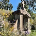 mausoleum surrounded by plant life