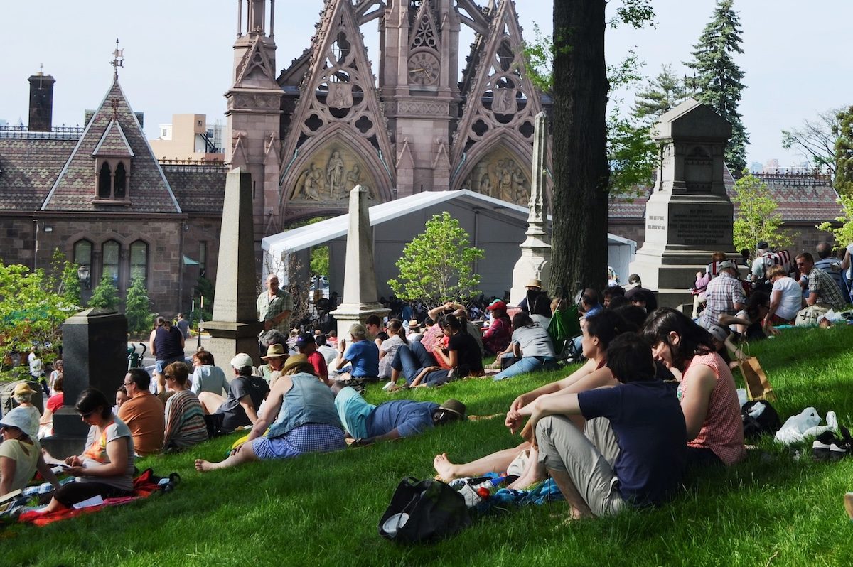 memorial day concertgoers near main entrance arch